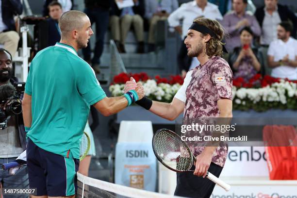 Stefanos Tsitsipas of Greece shakes hands with Jan-Lennard Struff of Germany at the net after being defeated in the Men's Quarter-Final match on Day...