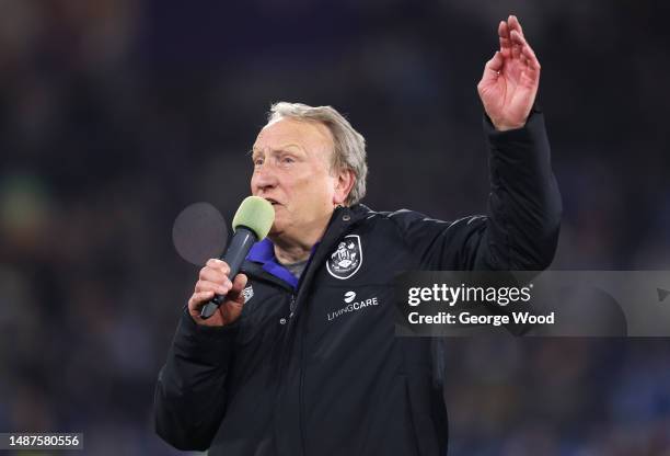 Neil Warnock, Manager of Huddersfield Town, speaks to their fans after the team's victory in the Sky Bet Championship between Huddersfield Town and...