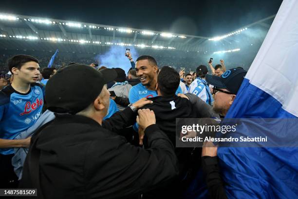 Juan Jesus of SSC Napoli, is surrounded by SSC Napoli fans on the pitch after their side wins the Seria A title after the Serie A match between...