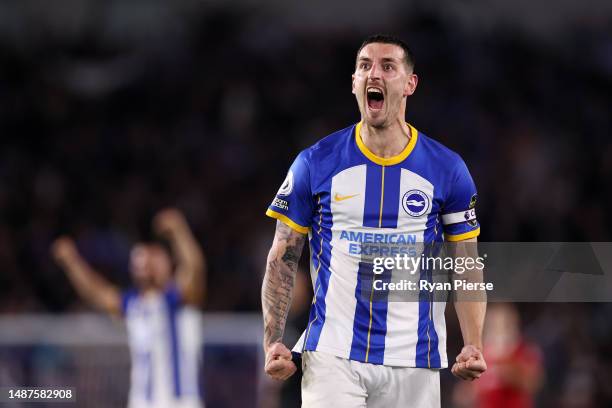 Lewis Dunk of Brighton & Hove Albion celebrates after the team's victory in the Premier League match between Brighton & Hove Albion and Manchester...