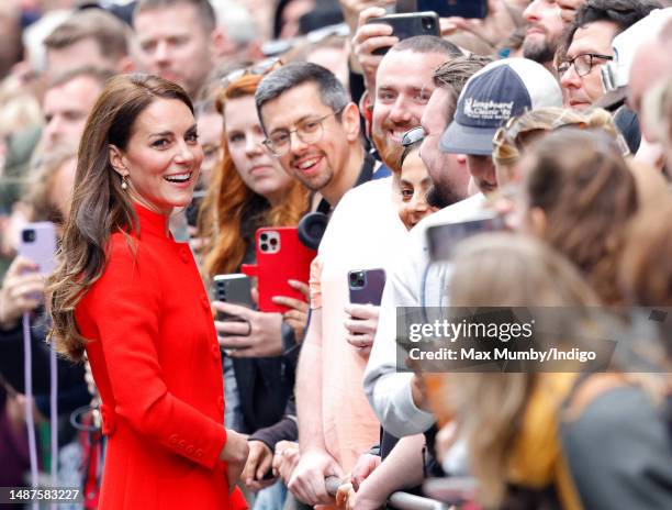 Catherine, Princess of Wales meets members of the public during a walkabout after a visit to the Dog & Duck pub in Soho to hear how it's preparing...