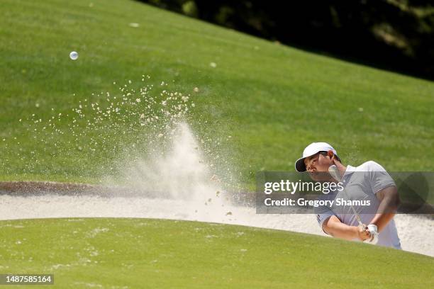 Tom Kim of South Korea plays a shot from a greenside bunker on the eighth hole during the first round of the Wells Fargo Championship at Quail Hollow...