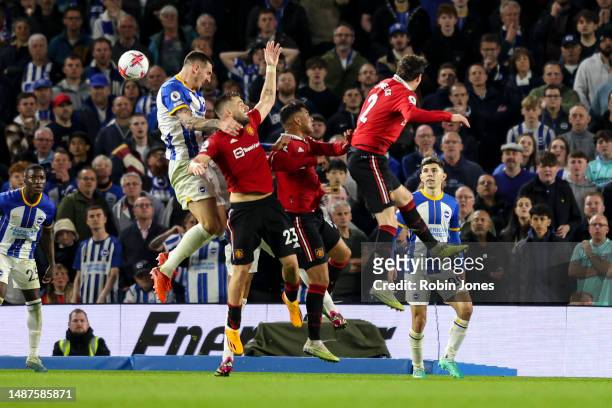 Luke Shaw of Manchester United is punished for handball after a VAR check and Referee Andre Marriner awards a penalty during the Premier League match...
