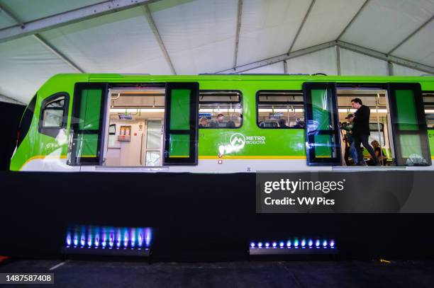 People take a look of the prototype of Bogota's metro car during the unveil event of Bogota's Metro car as Bogota's metro system starts works o be...