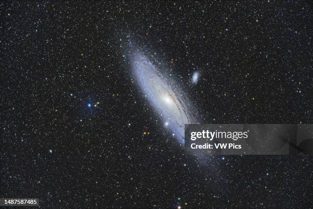 The well-known Andromeda Galaxy, Messier 31, with its companion galaxies. M32, below it and seemingly embedded in M31's outer arms, and M110 above...