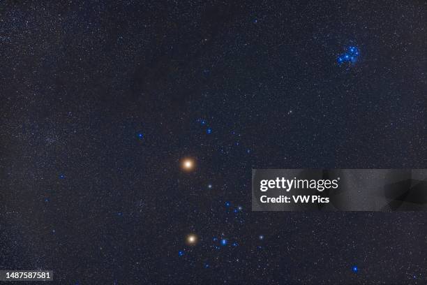 Bright reddish Mars above the Hyades star cluster with yellow Aldebaran below Mars to serve as a 'compare and contrast ' to Mars. The blue Pleiades...