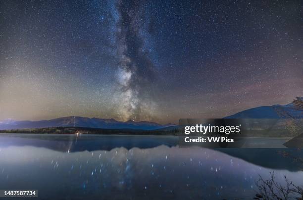 The summer Milky Way over and reflected in the relatively calm water of Pyramid Lake in Jasper National Park, on a mid-October night. The Jasper Sky...