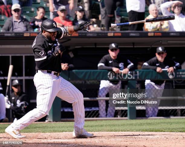 Hanser Alberto of the Chicago White Sox loses his bat as he strikes out during the tenth inning of a game against the Minnesota Twins at Guaranteed...