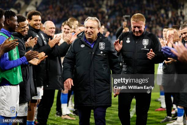 Neil Warnock the manager of Huddersfield Town receives a guard of honour from his players during the Sky Bet Championship game between Huddersfield...