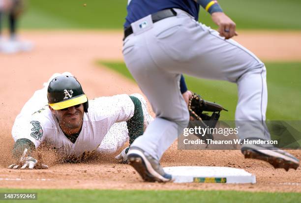 Ramon Laureano of the Oakland Athletics steals third base against the Seattle Mariners in the bottom of the six inning at RingCentral Coliseum on May...