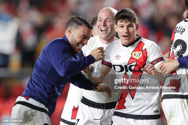 Raul De Tomas alias RDT of Rayo Vallecano de Madrid celebrates with teammates Isaac Palazon Camacho alias Isi and Fran Gracia after winning the...