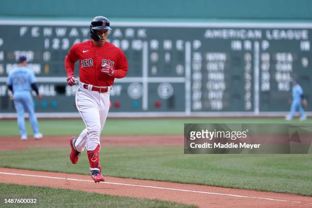 Masataka Yoshida of the Boston Red Sox rounds the bases after hitting a home run against the Toronto Blue Jays during the first inning at Fenway Park...