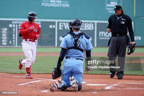 Masataka Yoshida of the Boston Red Sox rounds the bases after hitting a home run against the Toronto Blue Jays during the first inning at Fenway Park...