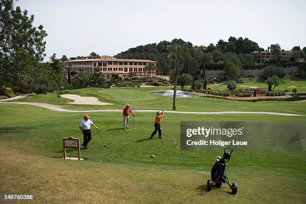 golfers on tee at arabellasheraton golf hotel son vida golf course. - arabella hotel stock pictures, royalty-free photos & images