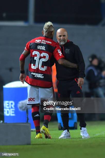 Arturo Vidal of Flamengo hugs Jorge Sampaoli, head coach of Flamengo during a Copa CONMEBOL Libertadores 2023 Group A match between Racing Club and...