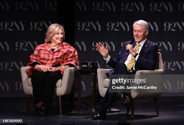 Secretary Hillary Rodham Clinton and President Bill Clinton speak onstage during In Conversation with David Rubenstein at The 92nd Street Y, New York...