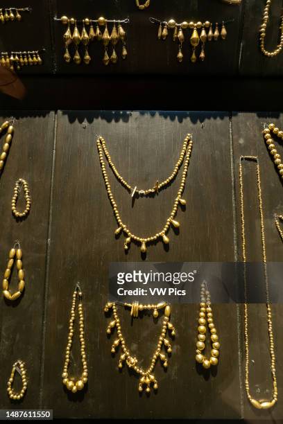 Gold necklaces and bracelets in a display in the Museum of Cultures of Oaxaca, Oaxaca, Mexico. From Tomb 7, Monte Alban. Late Postclassic Period,...