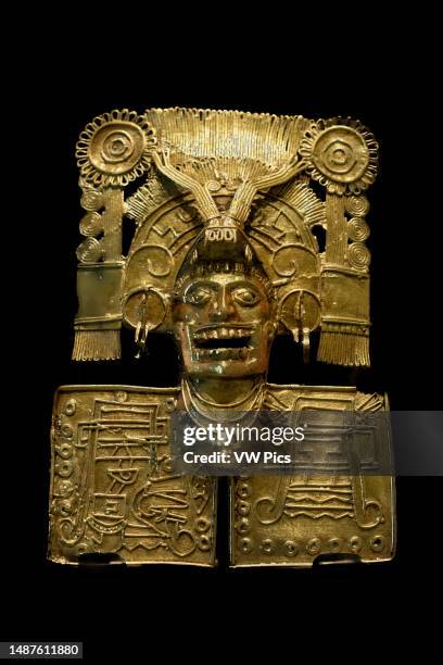 Solid gold pectoral of the Mixtec deity Coo Dzavui or Rain Serpent. Museum of Cultures of Oaxaca , Oaxaca, Mexico. He wears an elaborate feathered...