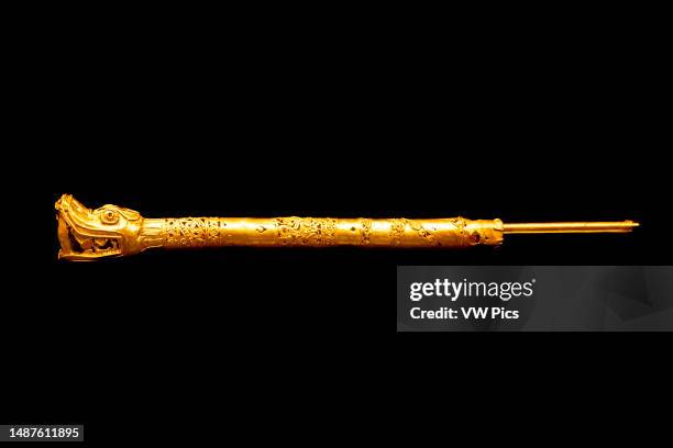 Golden fan handle with a feathered serpent head from Tomb 7 at Monte Alban. Museum of Cultures of Oaxaca , Oaxaca, Mexico. Feathers would have been...