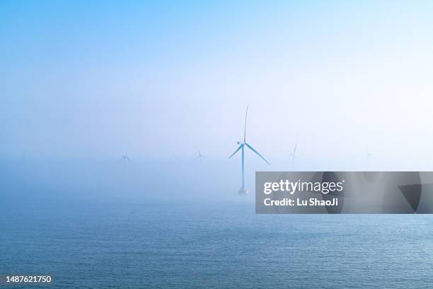 offshore wind farm in the sea. - wind farms stockfoto's en -beelden