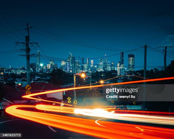 light trails of cars in the west suburb of brisbane in summer - brisbane transport stock pictures, royalty-free photos & images