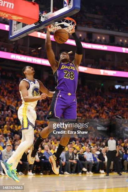 Rui Hachimura of the Los Angeles Lakers dunks the ball ahead of Jordan Poole of the Golden State Warriors during the first quarter in game two of the...