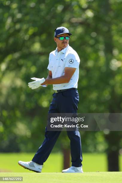 Rickie Fowler of the United States looks on from the ninth hole during the first round of the Wells Fargo Championship at Quail Hollow Country Club...