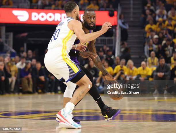 Stephen Curry of the Golden State Warriors guards LeBron James of the Los Angeles Lakers during the first quarter in game two of the Western...
