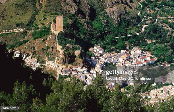 overloooking the castillo de la yedra and village nestled in a green valley. - cazorla stock pictures, royalty-free photos & images