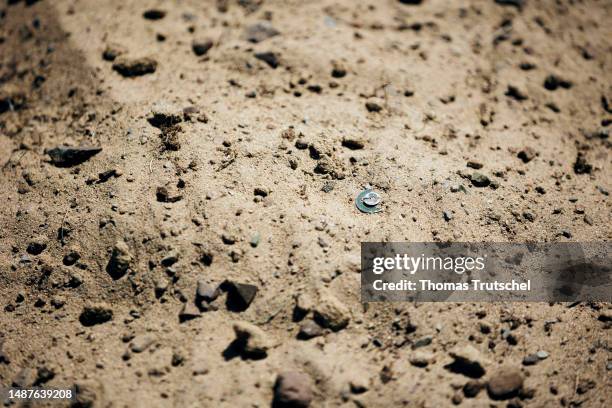 The detonator of a landmine sticks out of the ground on June 30, 2023 in Nalaikh, Mongolia.