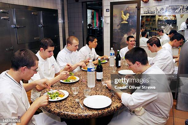 dining kitchen staff of paul bocuse restaurant, l'auberge du pont de collonges. - bocuse stock pictures, royalty-free photos & images