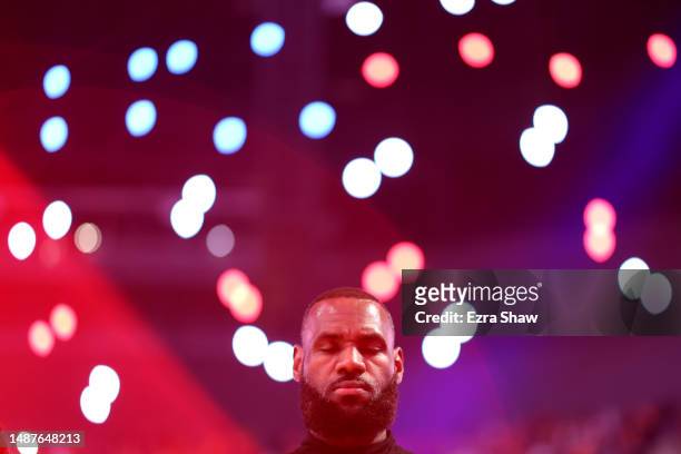 LeBron James of the Los Angeles Lakers stands for the national anthem prior to facing the Golden State Warriors in game two of the Western Conference...