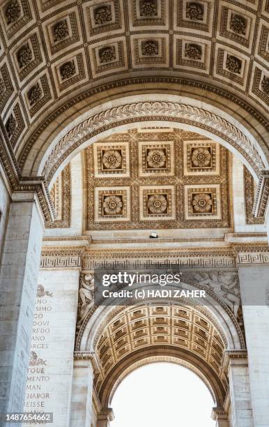 a vertical close up view of arc de triomphe de l'étoile in paris - champs elysees quarter stock pictures, royalty-free photos & images