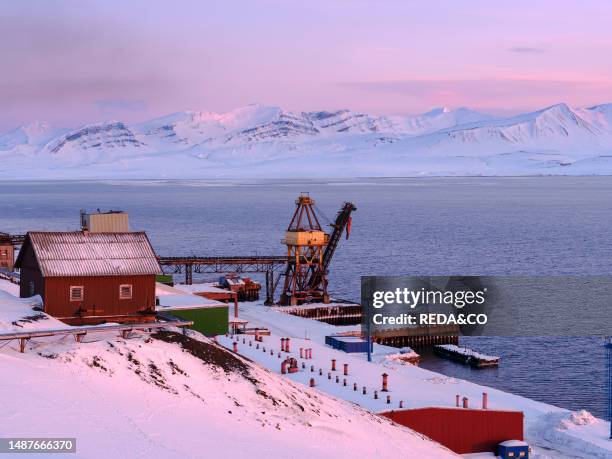 Harbour area. Russian coal mining town Barentsburg at fjord Groenfjorden, Svalbard. The coal mine is still in operation. Arctic Region, Europe,...