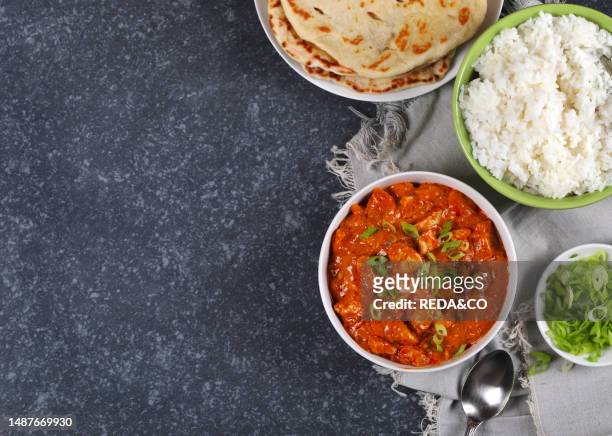 Chicken Tika. Chicken. Goulash. Basmati Rise. Background. Bowl. Bread. Butter. Butter Chicken. Canada. Close-up. Cooked. Cooking. Copy Space....