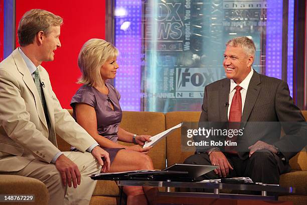 Head coach for the New York Jets Rex Ryan with hosts Steve Doocy and Gretchen Carlson at "FOX & Friends" at the FOX Studios on July 19, 2012 in New...