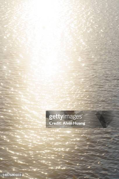 sunset at kawaguchiko lake and kawaguchiko bridge  , the sunset light reflected on the surface of the lake  in yamanashi prefecture, japan - lake reflection stock pictures, royalty-free photos & images