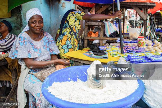 Congolese shopkeeper in front of her manioc "foufou" stall at the Total market in Brazzaville, 24 March 2017.