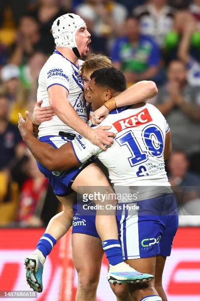 Jacob Preston of the Bulldogs celebrates with team mates after scoring a try during the round 10 NRL match between Canterbury Bulldogs and Canberra...