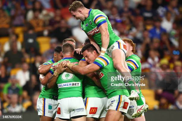 Matthew Timoko of the Raiders celebrates with team mates after scoring a try during the round 10 NRL match between Canterbury Bulldogs and Canberra...