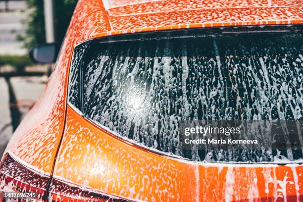 washing car at self-serve. car wash with high pressure washer. - car wash stock pictures, royalty-free photos & images