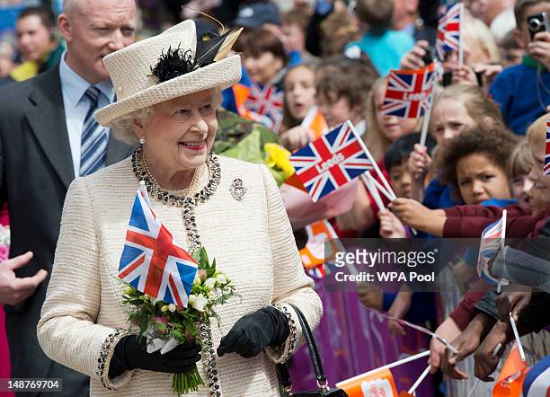Queen Elizabeth II meets members of the public during a visit to the City Varieties Music Hall where she watched a "Good Old Days" theatrical...
