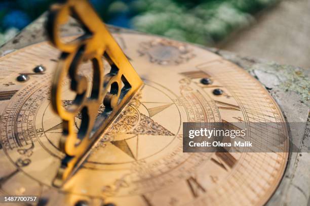 antique golden sundials close-up - ancient sundials stock pictures, royalty-free photos & images