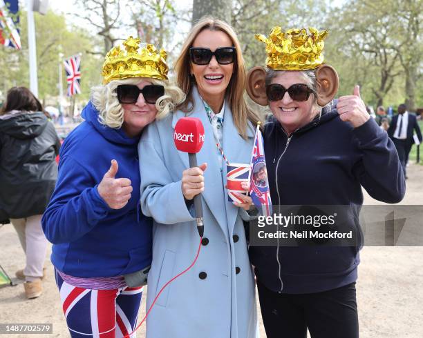 Amanda Holden of Heart Breakfast Radio meets members of the public dressed as King Charles III and Camilla, Queen consort as they camp outside...