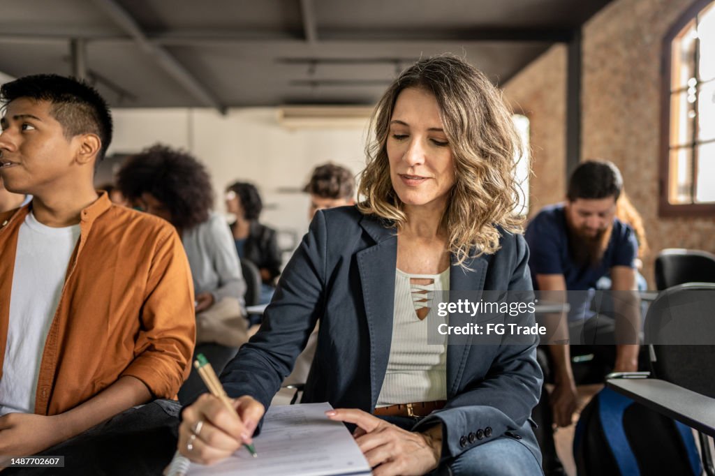Student Take Note Student Taking Notes During A Class At The University High-Res Stock ...