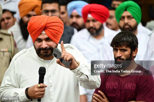 New Delhi, India – May 01: Congress leader Navjot Singh Sidhu with Wrestlers during the ongoing wrestlers protest against WFI chief Brij Bhushan...