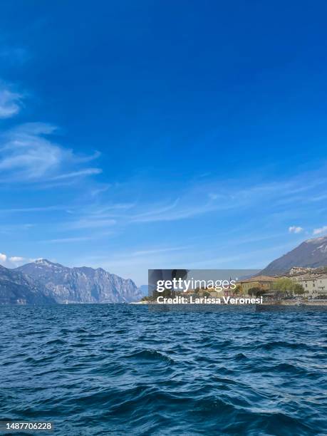 view of lake garda with the town of assenza - assenza stock pictures, royalty-free photos & images