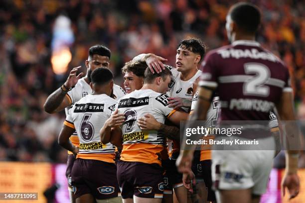 Billy Walters of the Broncos celebrates with team mates after scoring a try during the round 10 NRL match between Manly Sea Eagles and Brisbane...