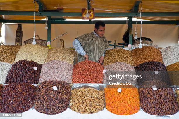 Africa, Morocco, Marrakesh, Jemaa El Fna Square, Food Market, Dry Fruit Seller Africa, Morocco, Marrakesh, Jemaa El Fna square, Food Market, Dried...