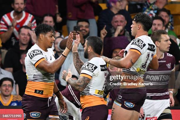 Selwyn Cobbo of the Broncos celebrates with team mates after scoring a try during the round 10 NRL match between Manly Sea Eagles and Brisbane...